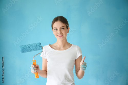 Young female painter with r...