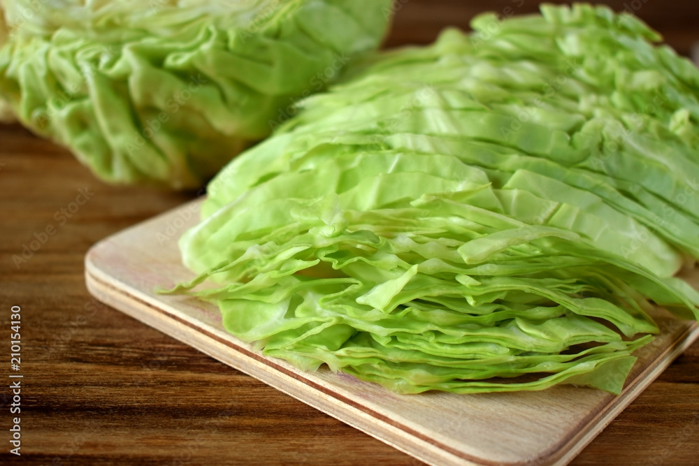 Chopped white cabbage on a wooden board Chopped white cabbage on a wooden board