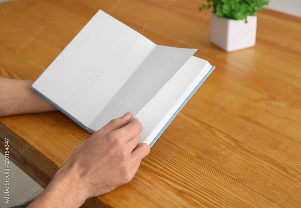 Man reading interesting book at home Man reading interesting book at home