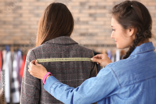 Young female tailor working...
