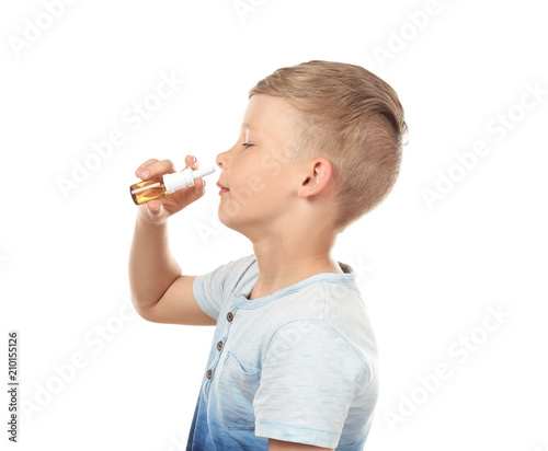 Little boy using nasal drop...
