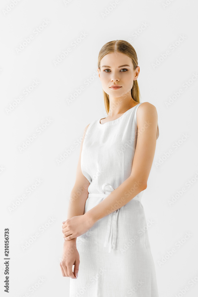 young attractive woman in linen white dress posing isolated on grey background young attractive woman in linen white dress posing isolated on grey background
