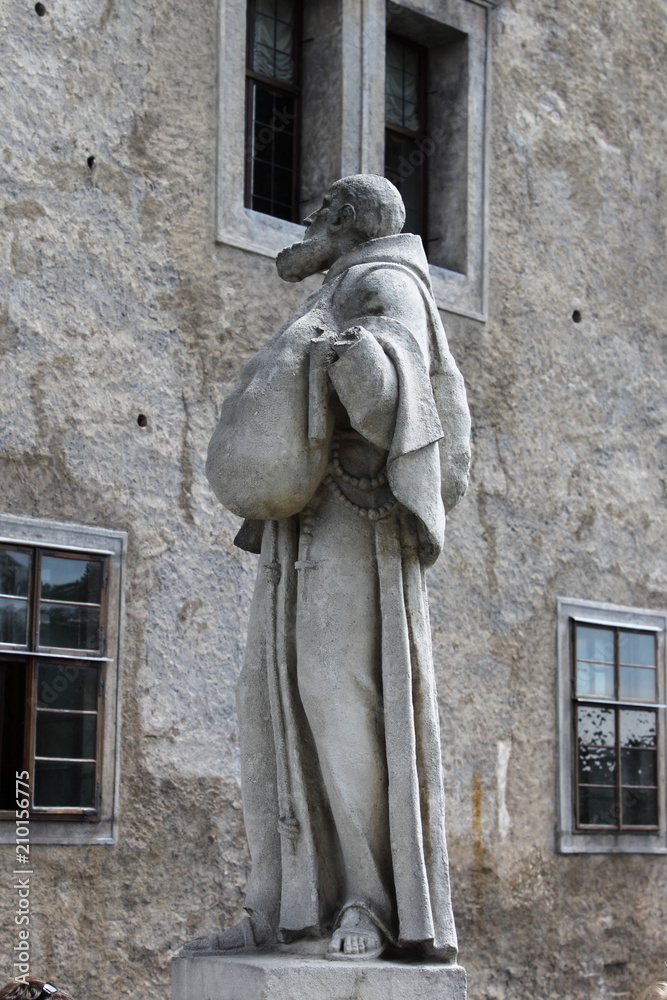 Statue of a franciscan monkin in Cesky Krumlov, Czech Republic