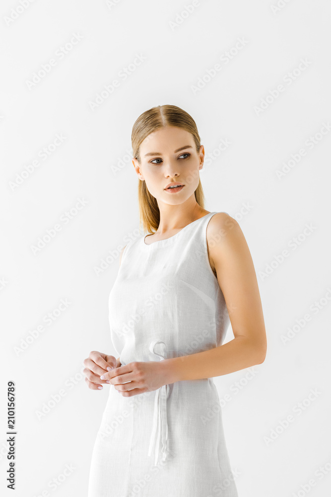 young beautiful woman in linen white dress looking away isolated on grey background young beautiful woman in linen white dress looking away isolated on grey background