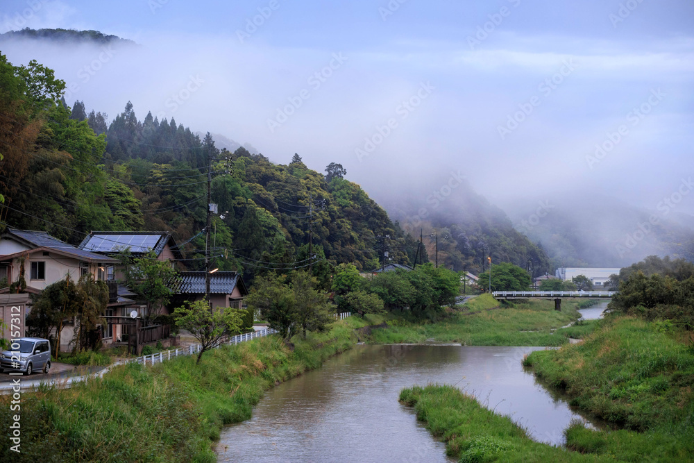 Homes in a small village next to river in rural Japan