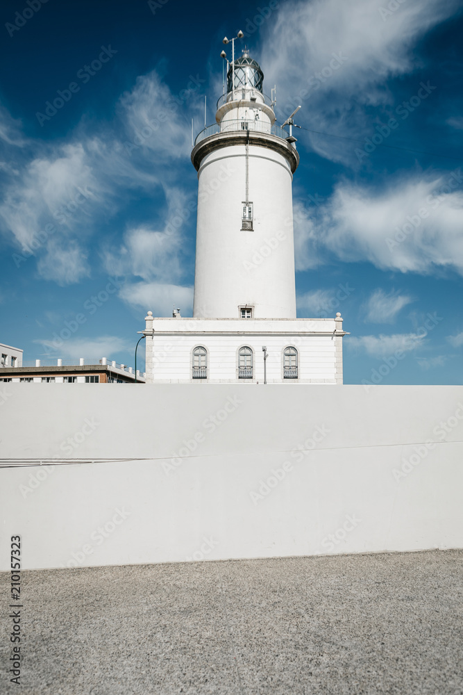 Malaga port Lighthouse with blue sky, Spain