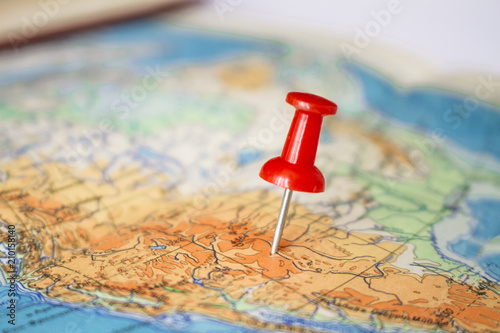 Red pushpin on map on map.Concept of travelling