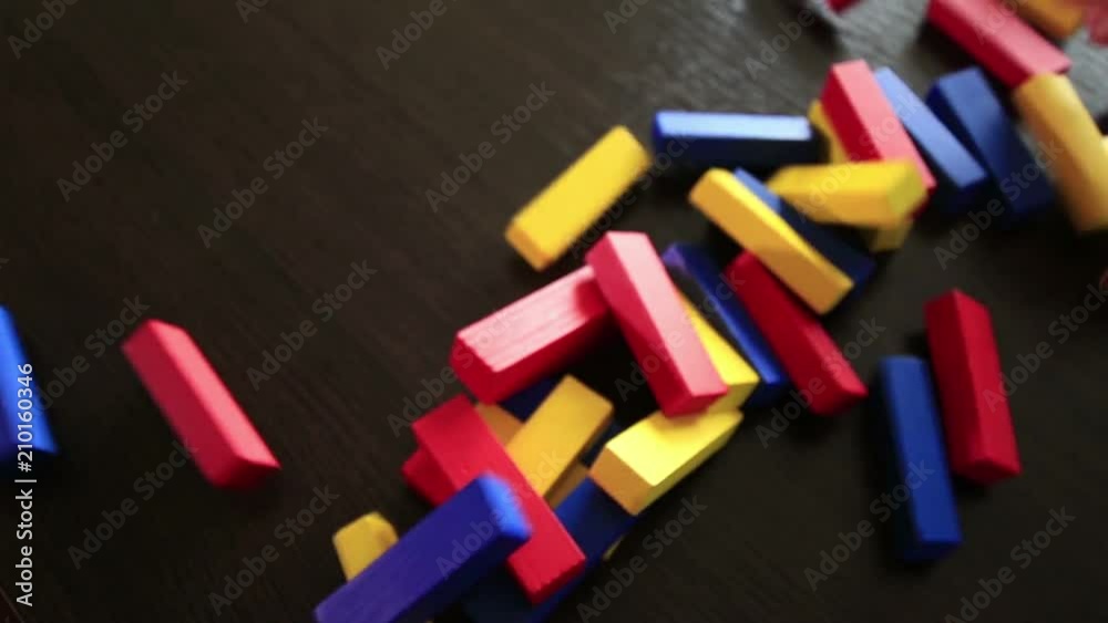 Jenga colored wooden tower crumbles after block move (1080p, 50fps)
