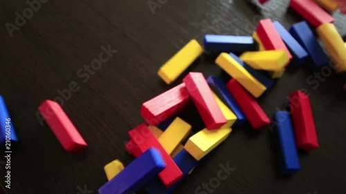 Jenga colored wooden tower crumbles after block move (1080p, 50fps)