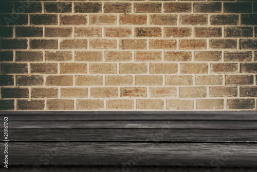 Selected focus empty black wooden table and wall texture or old black brick wall blur background image. for your photomontage or product display