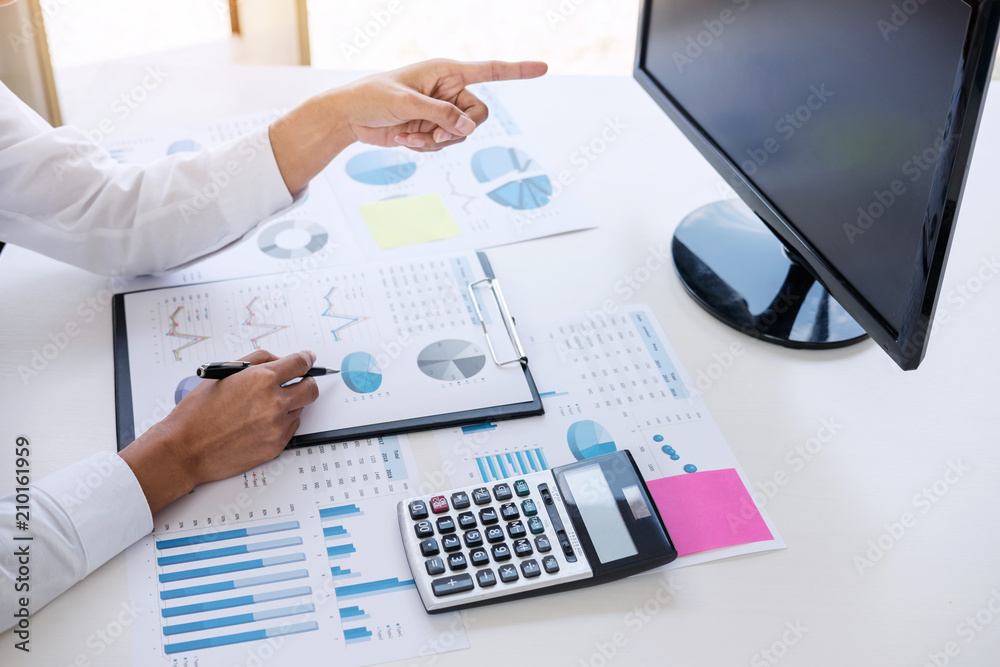 Business accountant or banker, business woman pointing and analysis with stock financial indices and financial costs wisely and carefully, investment and saving concept Business accountant or banker, business woman pointing and analysis with stock financial indices and financial costs wisely and carefully, investment and saving concept