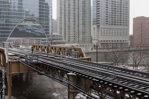 Snow lightly covering a train bridge