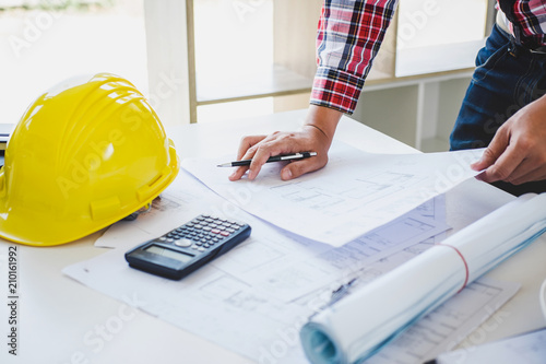 Workplace items tools for project, Architect or Engineer working on blueprint for architectural project in progress, construction and structure concept