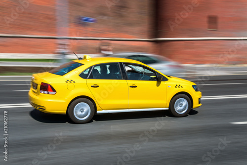 yellow taxi cab speeding