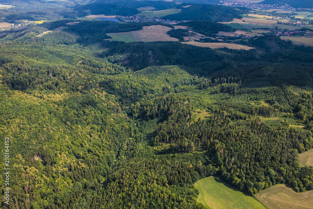 Landscape with beautiful green forest, meadows and fields in Czech republic, Europe