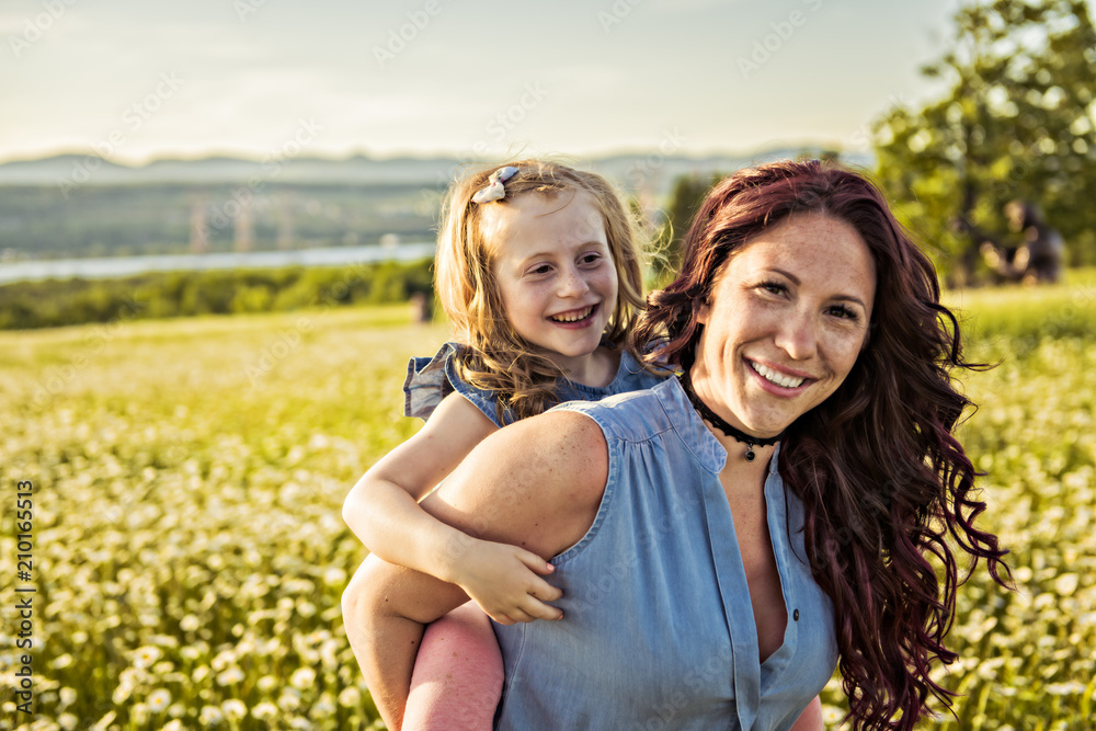 Mother spending time with daughter during the sunset. Mother spending time with daughter during the sunset.