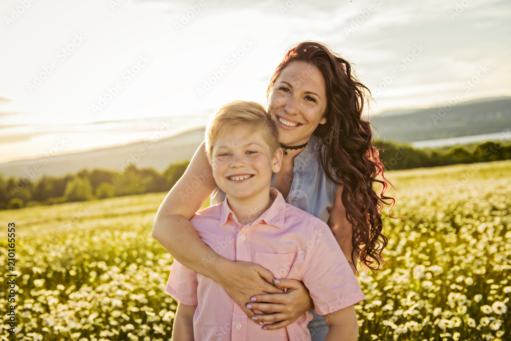 Mother spending time with son during the sunset. Mother spending time with son during the sunset.
