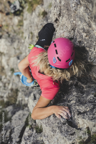 Fototapeta Naklejka Na Ścianę i Meble -  A Woman  Climber Climbing a Rock