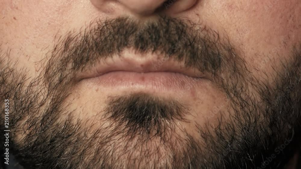 Man taking pill, tablet of drugs or medicine on tongue with open mouth. Painkiller treatment or party narcotic, close up Man taking pill, tablet of drugs or medicine on tongue with open mouth. Painkiller treatment or party narcotic, close up