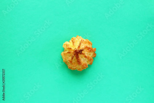Cookie on a bright turquoise background  top view.
