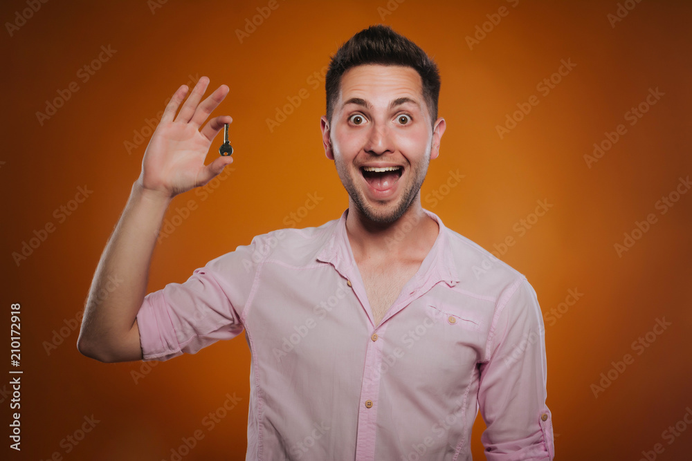 The guy holds the key to the apartment. Real estate. Housing purchase. sale of apartment. The guy holds the key to the apartment. Real estate. Housing purchase. sale of apartment.