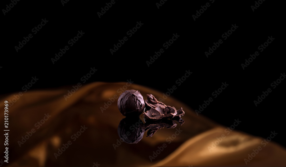 praline also black background with golden cloth praline also black background with golden cloth