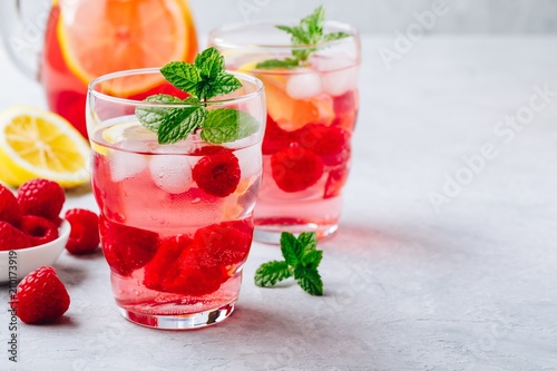 Cold drink Raspberry Lemonade with mint in glass.