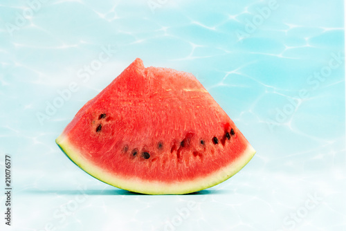 A slice of a watermelon on a blue background.