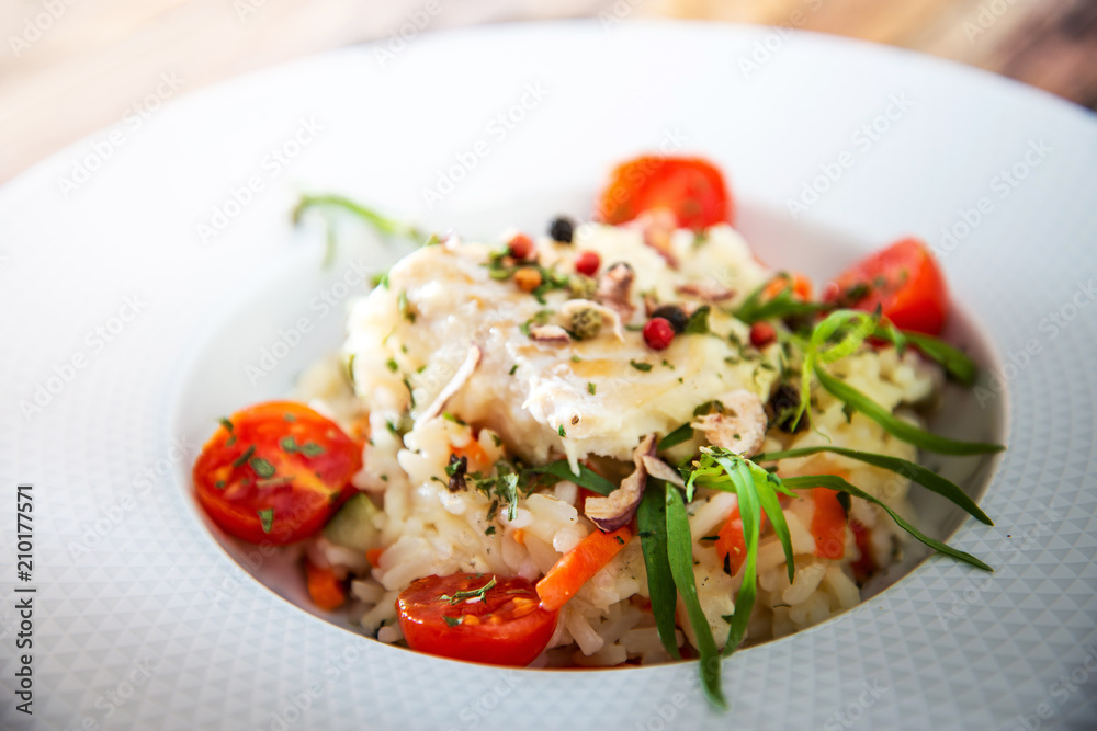 Cooked rice with vegetables, cod and lemon sauce Cooked rice with vegetables, cod and lemon sauce