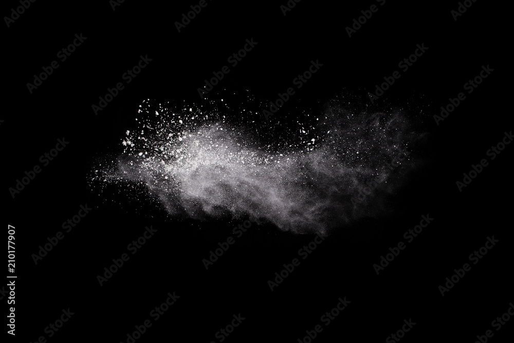 Launched white powder, isolated on black background.