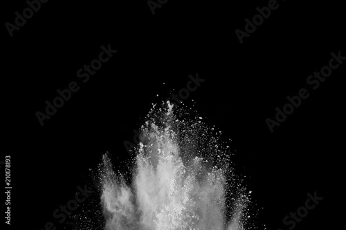 Fototapeta Naklejka Na Ścianę i Meble -  Launched white powder, isolated on black background.