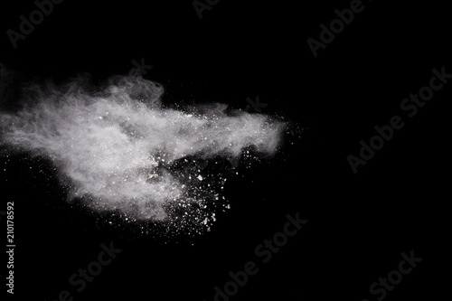 Launched white powder, isolated on black background.