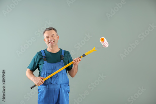 Male painter in uniform wit...