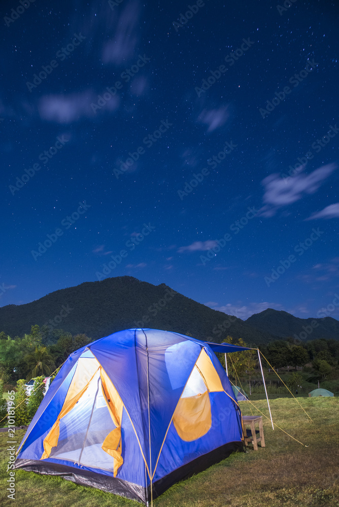 Tent camping surround by mountain night time