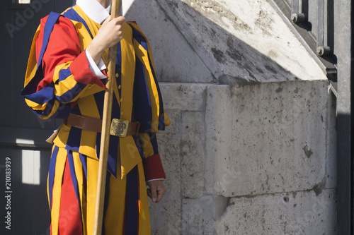 A member of the Pontifical Swiss Guard who protect the pope in Vatican City photo