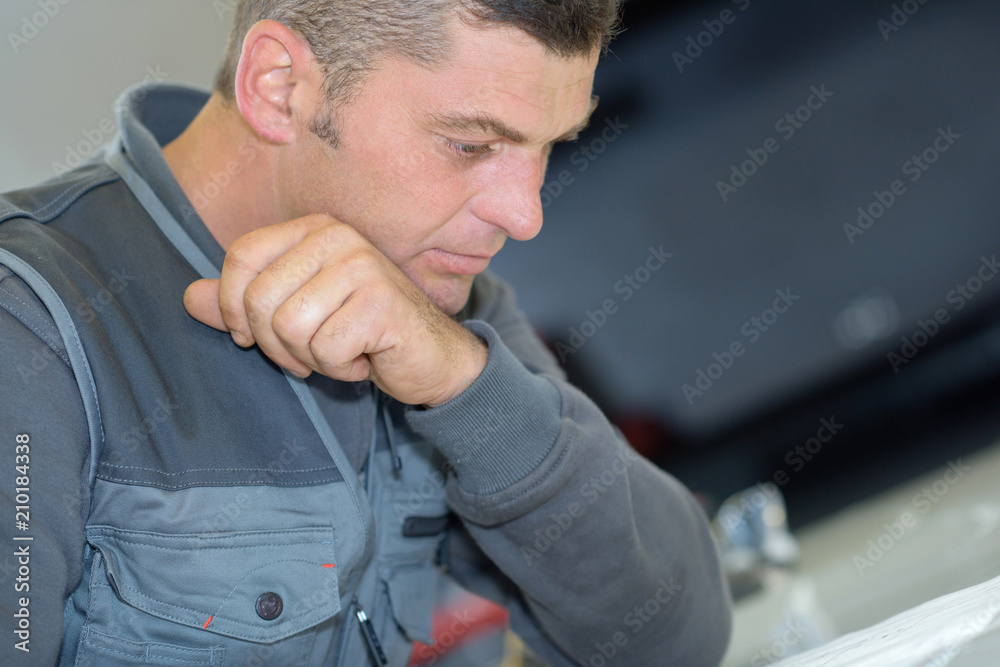 portrait of a handsome worker in his factory portrait of a handsome worker in his factory