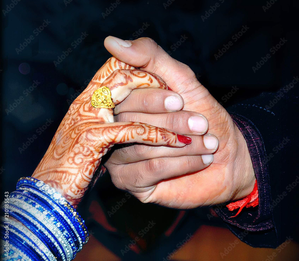 Premium Photo | Newlyweds with two gold wedding rings close up. wedding  couple holding their rings. wedding. marriage ceremony