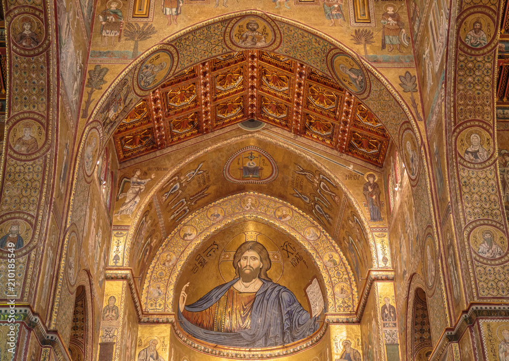Interior of  cathedral Santa Maria Nuova  is famous for its Byzantine mosaics. Above main altar is a mosaic depicting Christ Pantokrator