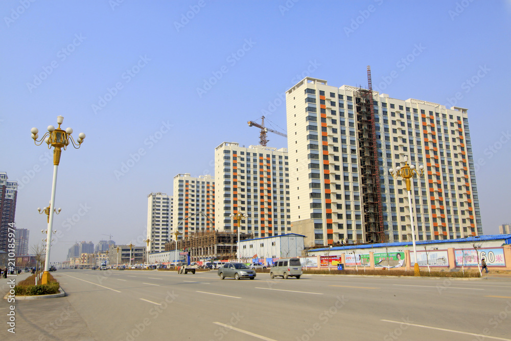high rise residential buildings and roads in a city