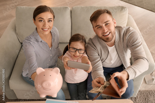 Happy family counting money...