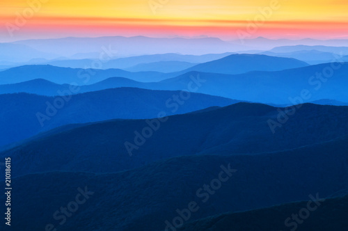 blue range of mountains on sunset © Volodymyr Shevchuk