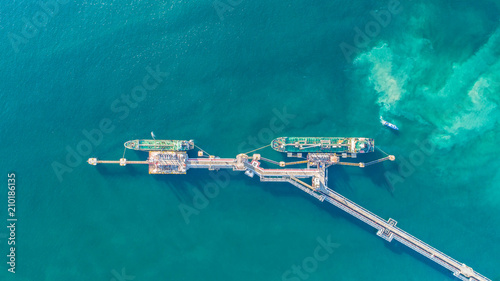 oil tanker, gas tanker in the high sea.Refinery Industry cargo ship,aerial view,Thailand, in import export, LPG,oil refinery, Logistics and transportation with working crane bridge in harbor