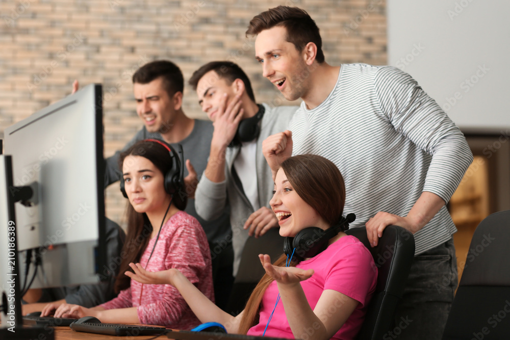 Young people playing video games at tournament Young people playing video games at tournament