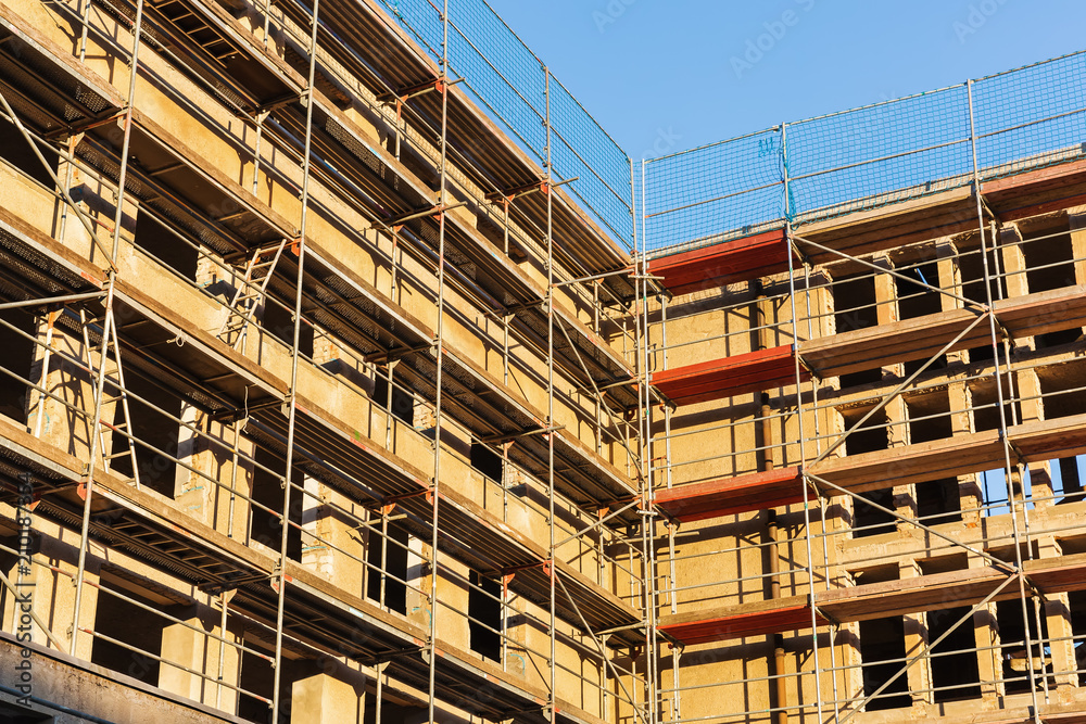 building construction site with scaffolds