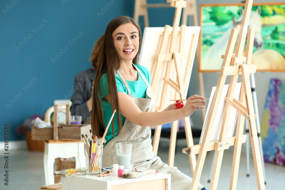 Female student during classes in school of painters Female student during classes in school of painters