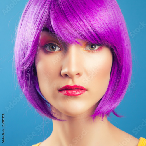 beautiful woman wearing colorful wig © merydolla