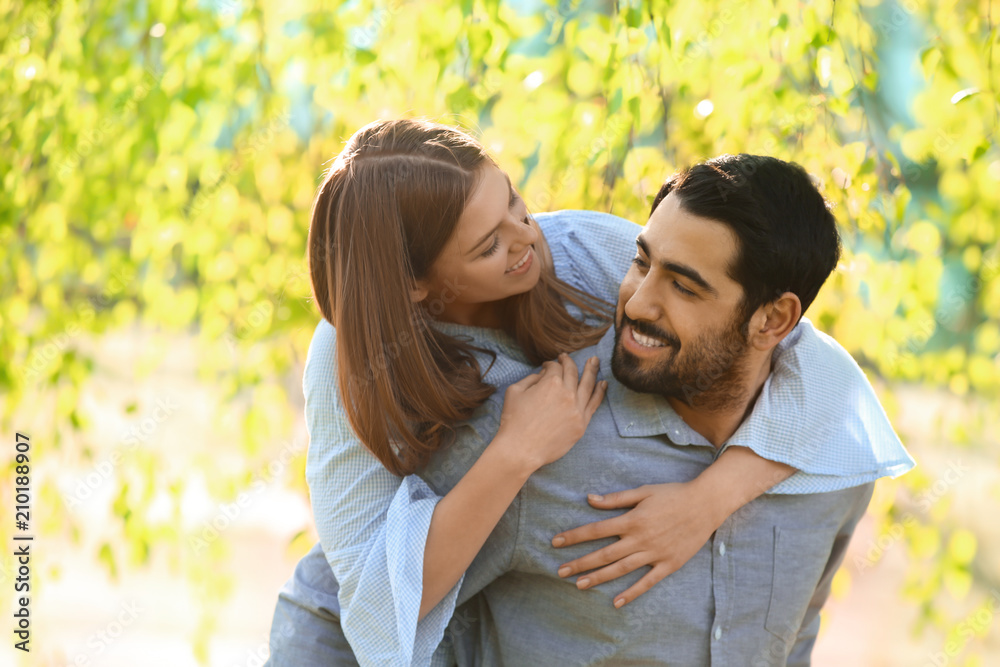 Happy young couple in park on spring day Happy young couple in park on spring day