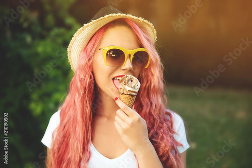 Young woman eating ice cream outdoor