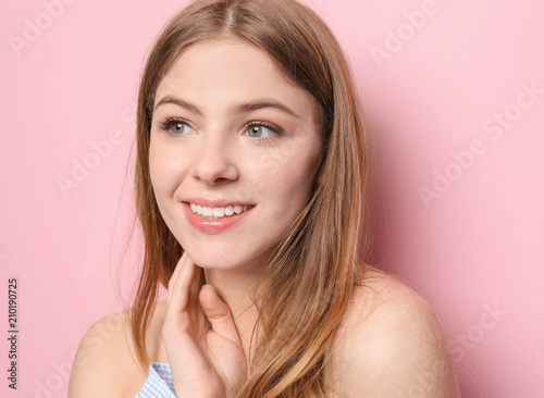 Beautiful young woman on color background © Pixel-Shot