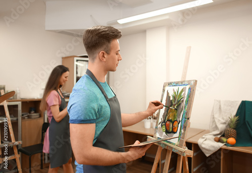 Art students painting in workshop